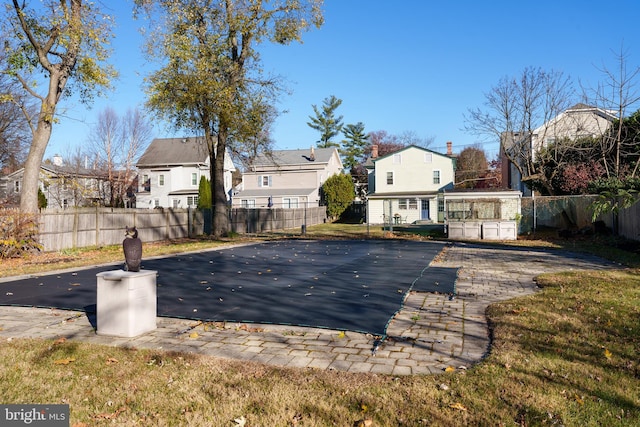 view of pool with a yard