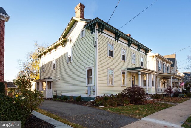 120 S Main St, Pennington, NJ 08534 - view of property exterior with a chimney and a porch