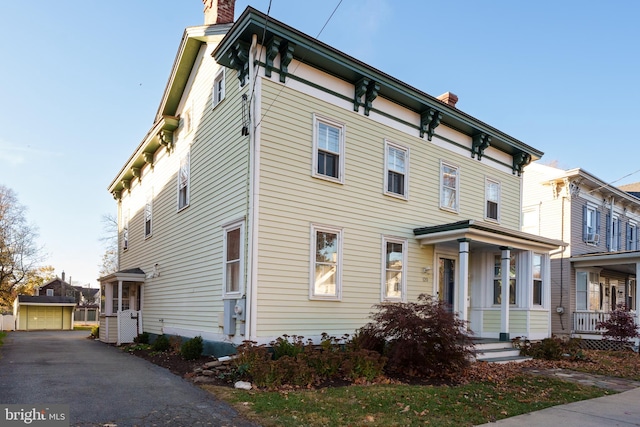 view of front of house with an outbuilding and a garage