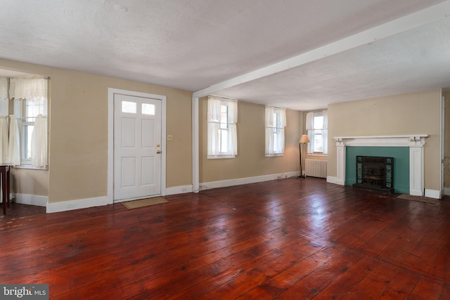 120 S Main St, Pennington, NJ 08534 - unfurnished living room featuring radiator, baseboards, hardwood / wood-style floors, and a fireplace