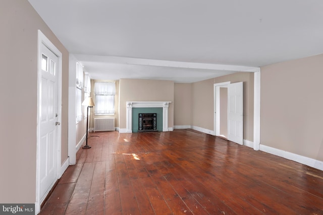 120 S Main St, Pennington, NJ 08534 - unfurnished living room with radiator, wood-type flooring, a fireplace with flush hearth, and baseboards