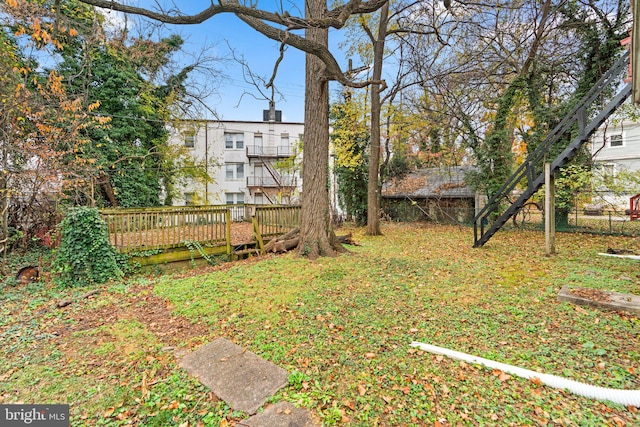 view of yard featuring a wooden deck