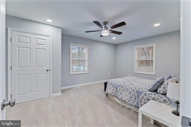 carpeted bedroom with ceiling fan