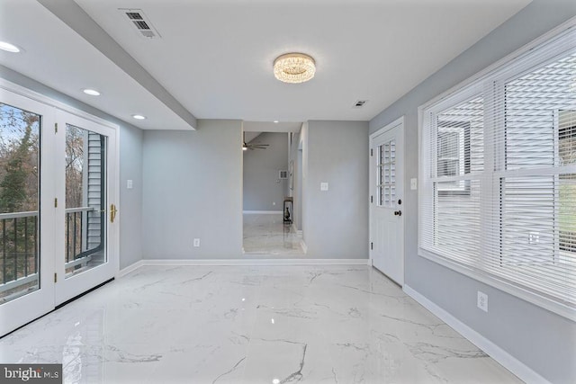 entryway with plenty of natural light and ceiling fan