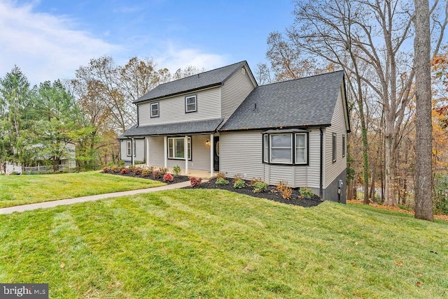 view of property featuring a front lawn