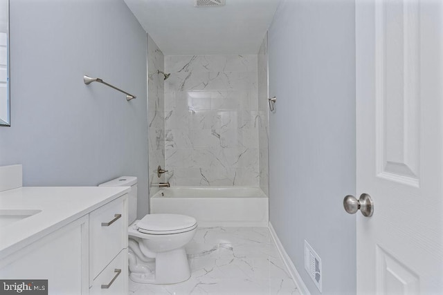 full bathroom with vanity, tiled shower / bath combo, and toilet