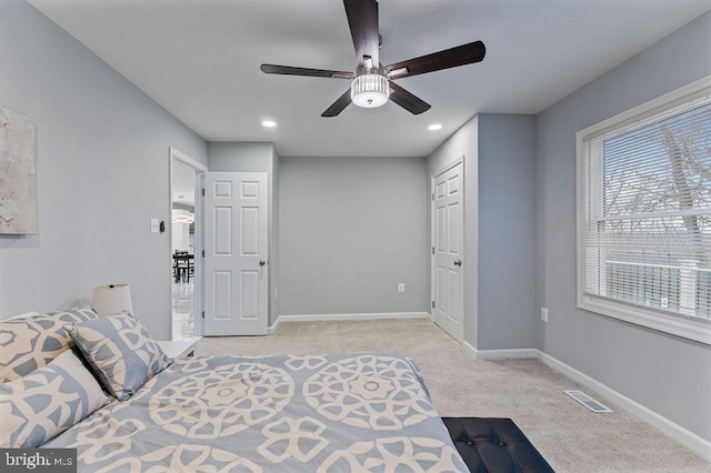 carpeted bedroom featuring ceiling fan