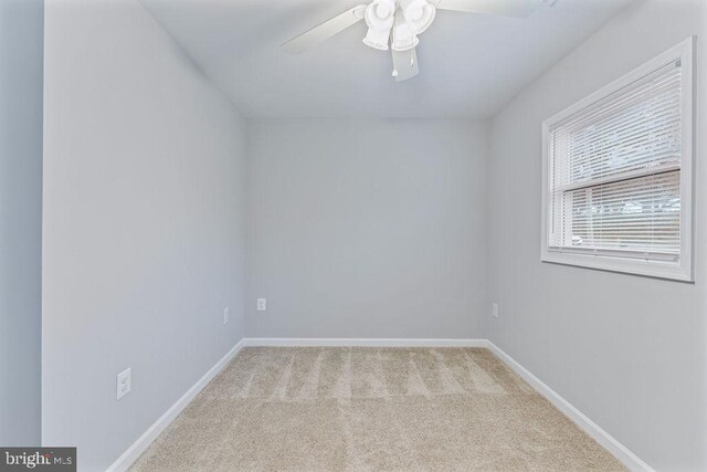 carpeted empty room with ceiling fan