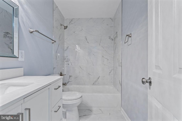 full bathroom with vanity, tiled shower / bath combo, and toilet