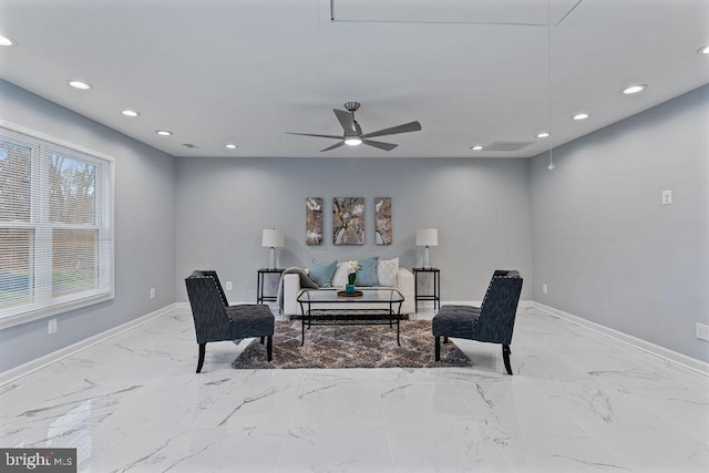 sitting room with ceiling fan