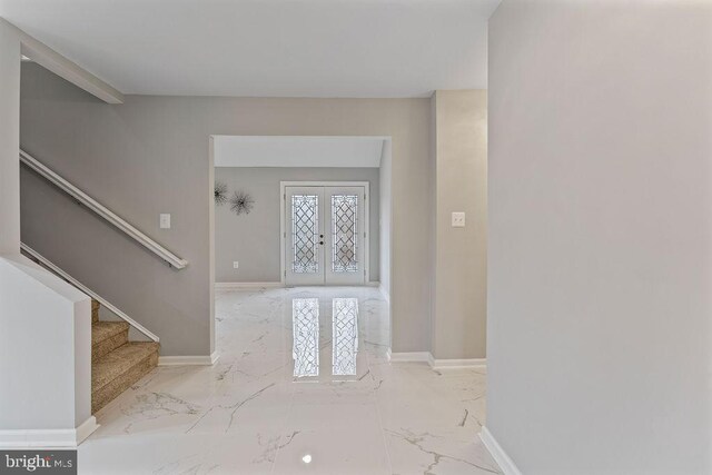 foyer entrance featuring french doors