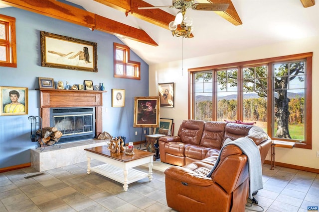 tiled living room with vaulted ceiling with beams and ceiling fan