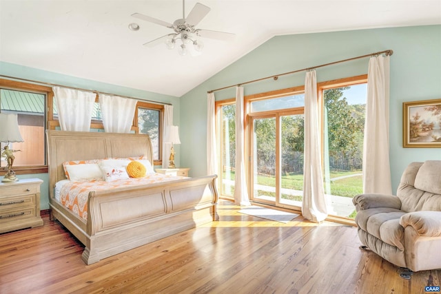 bedroom featuring ceiling fan, light wood-type flooring, access to outside, and lofted ceiling