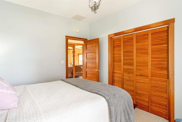 carpeted bedroom with a closet