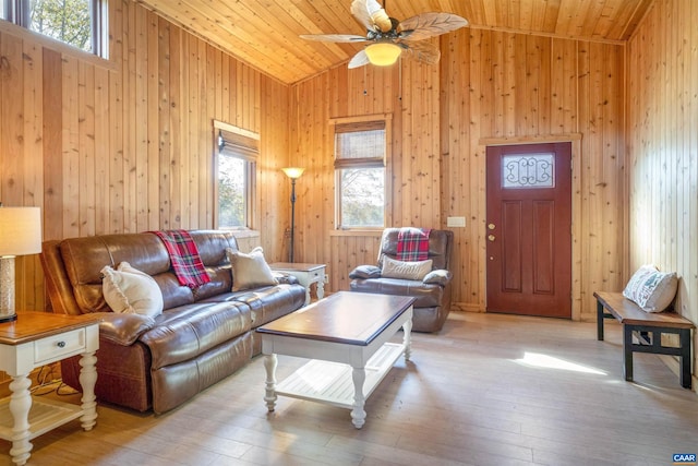 living room with ceiling fan, high vaulted ceiling, wooden ceiling, and light wood-type flooring