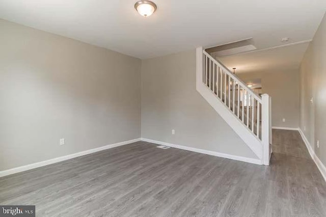 unfurnished room featuring dark hardwood / wood-style floors