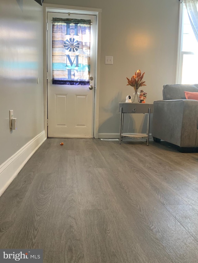 doorway to outside with hardwood / wood-style floors