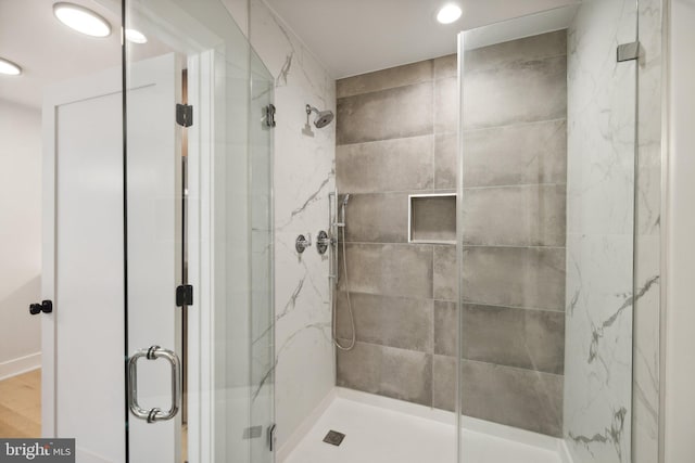 bathroom featuring an enclosed shower