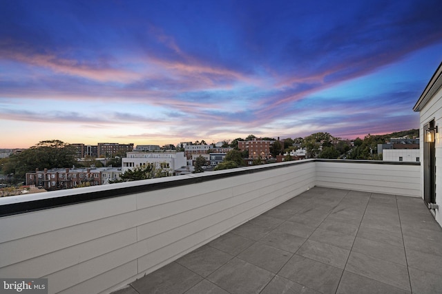 view of balcony at dusk