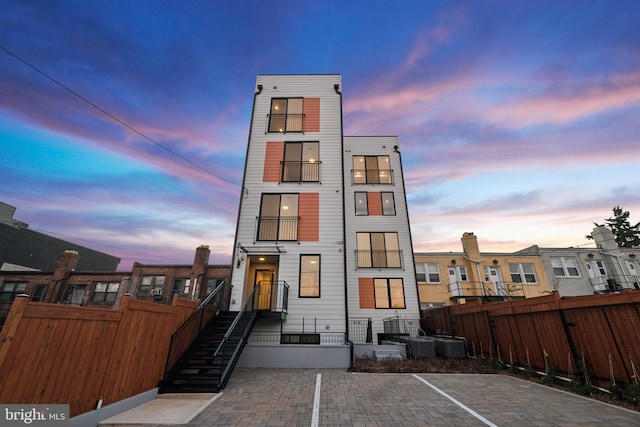 view of back house at dusk