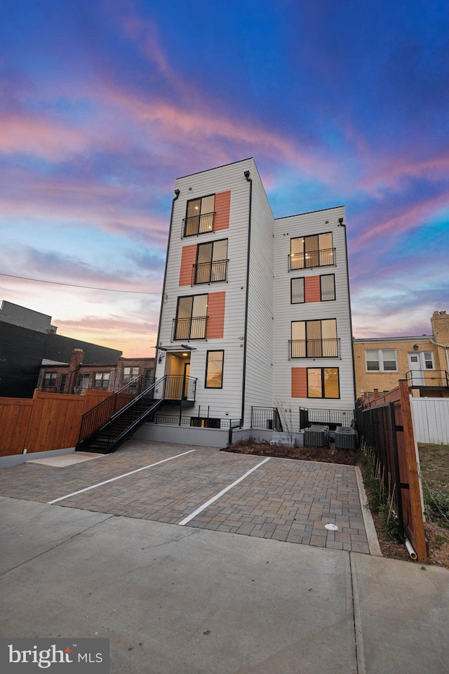 outdoor building at dusk with central AC unit