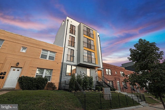 view of outdoor building at dusk