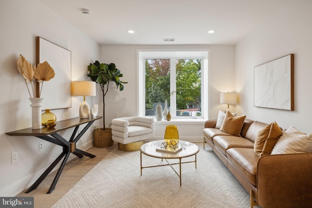 sitting room featuring light hardwood / wood-style floors