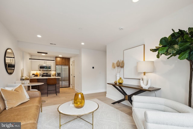 living room with light hardwood / wood-style floors