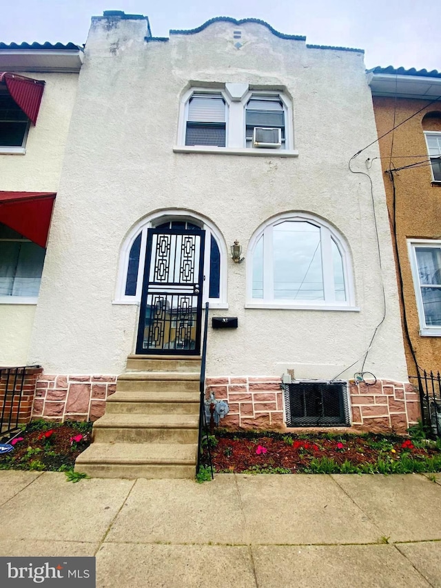 doorway to property featuring central air condition unit