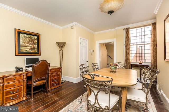 dining space featuring dark hardwood / wood-style flooring and ornamental molding