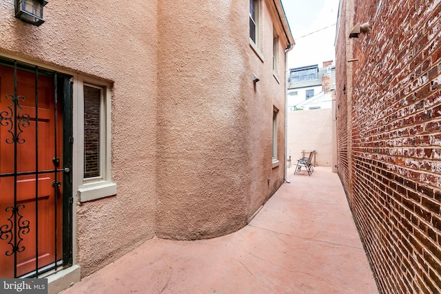 view of side of home featuring a patio area