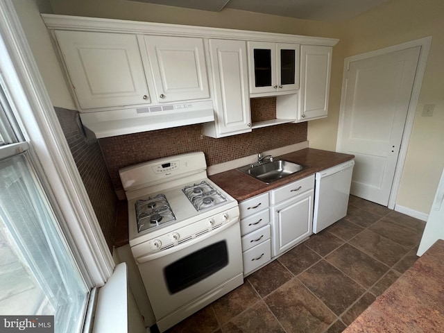 kitchen with sink, extractor fan, white appliances, decorative backsplash, and white cabinets