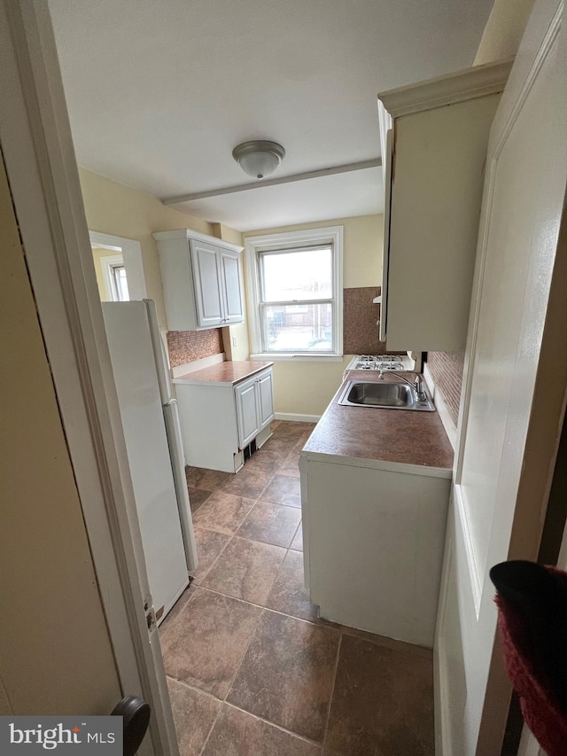 bathroom with tile patterned flooring and sink