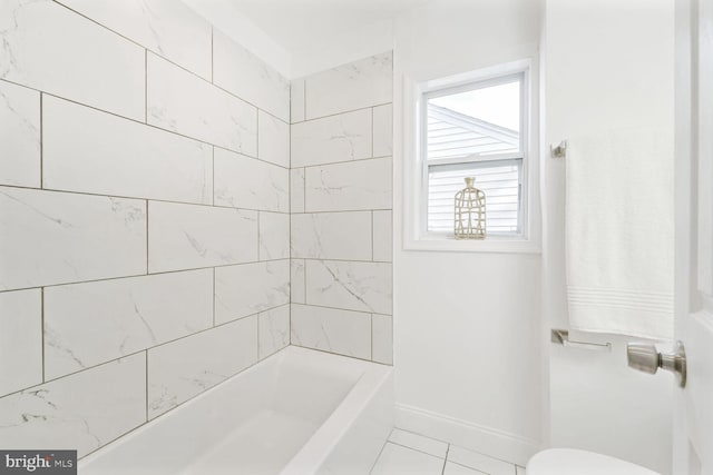 bathroom with tile patterned floors and toilet