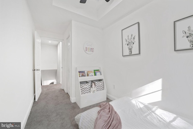 bedroom featuring ceiling fan and carpet