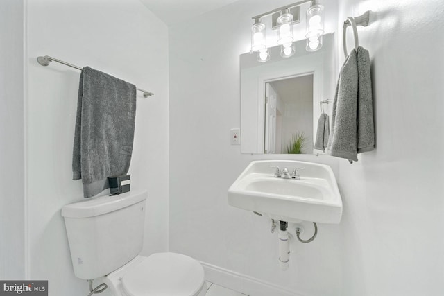 bathroom with tile patterned floors and toilet