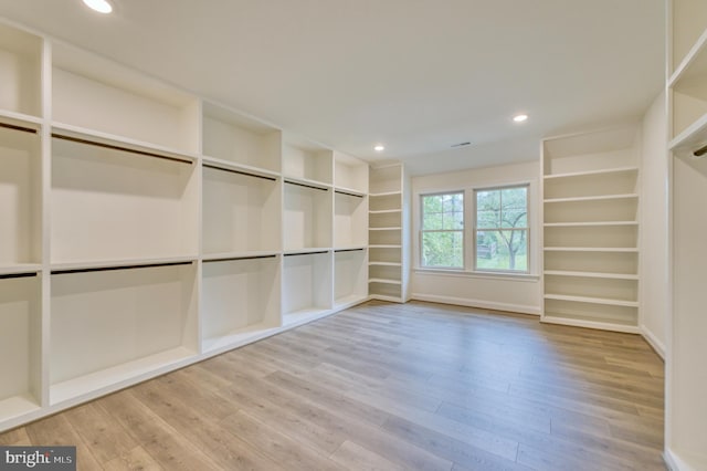 spacious closet featuring hardwood / wood-style floors