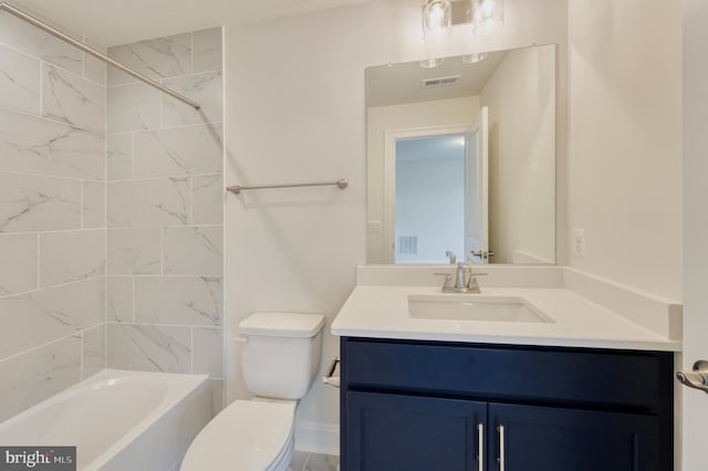 full bathroom featuring vanity, toilet, and tiled shower / bath