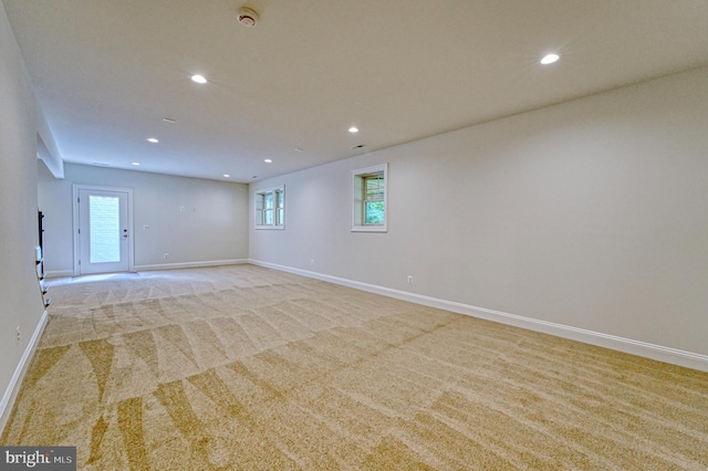 empty room with light colored carpet