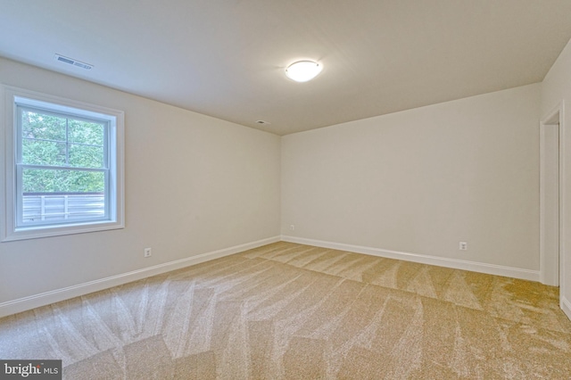 empty room with light colored carpet