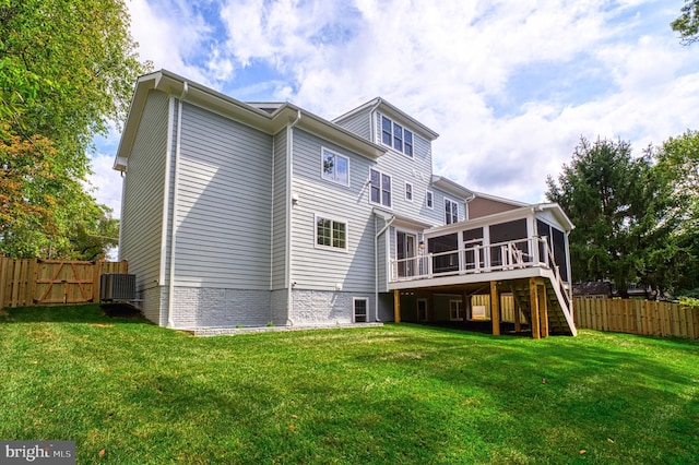 back of house with a yard, a deck, cooling unit, and a sunroom