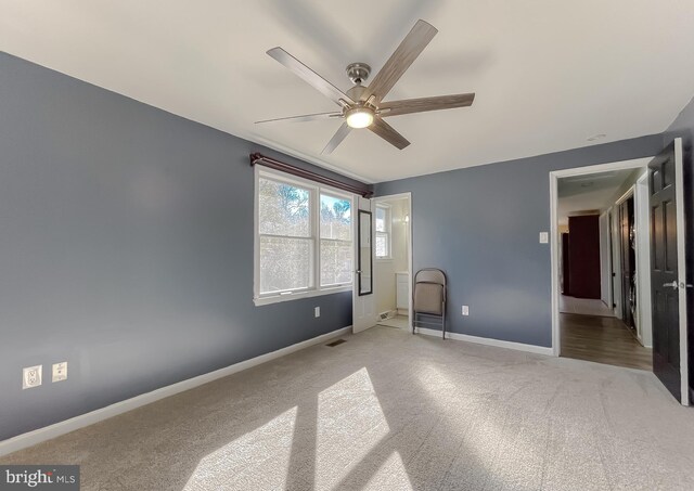 unfurnished bedroom with ceiling fan and carpet