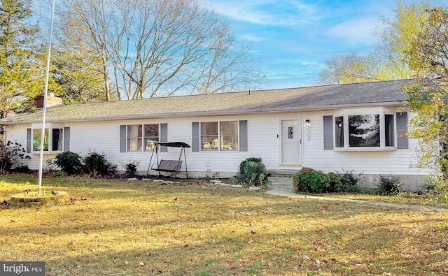 ranch-style house featuring a front lawn