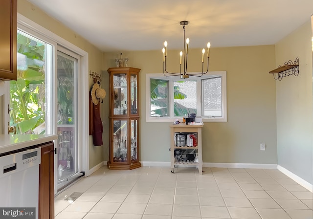 unfurnished dining area featuring light tile patterned flooring and a chandelier