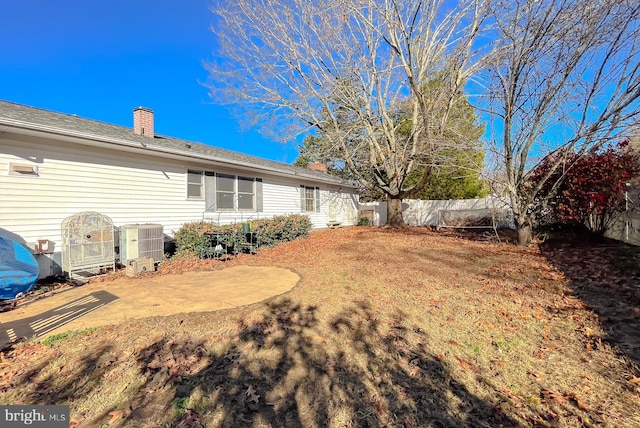 view of yard with a patio area and central AC