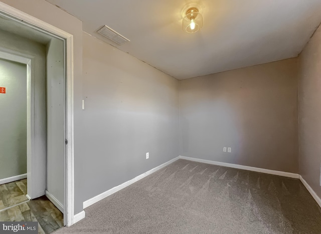 unfurnished room featuring carpet flooring