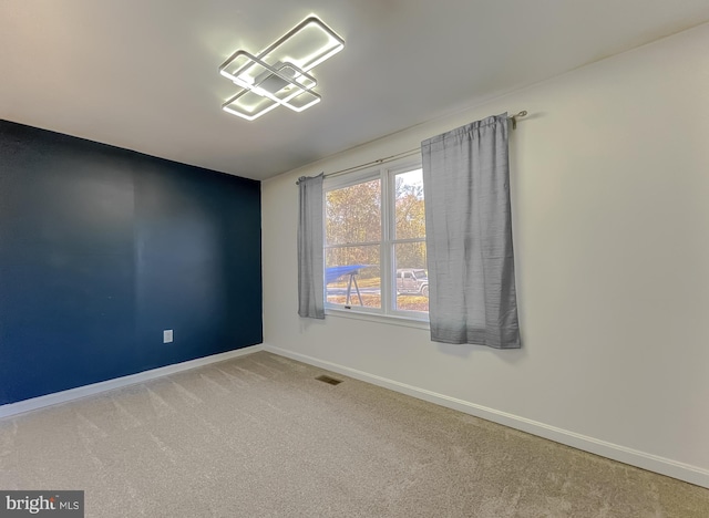 empty room with carpet flooring