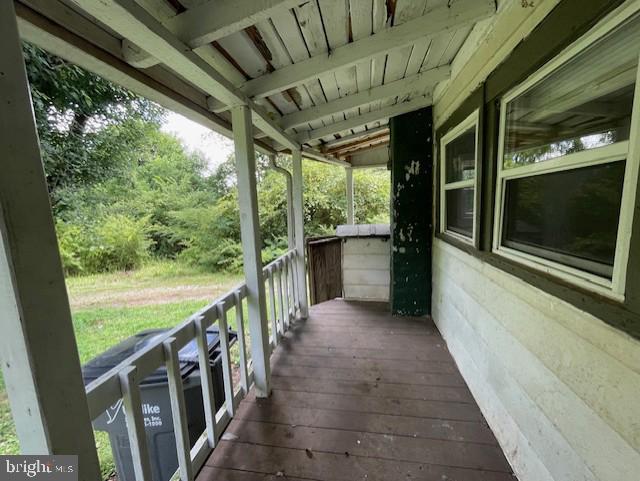 wooden terrace featuring a porch