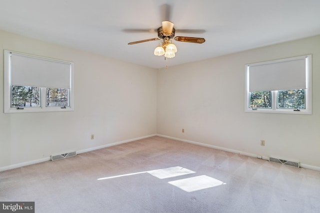 carpeted empty room with ceiling fan