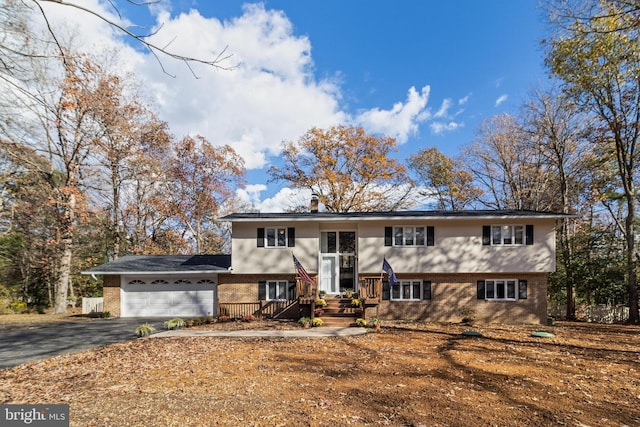 raised ranch featuring a garage